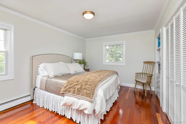 a bedroom with a bed and a chair