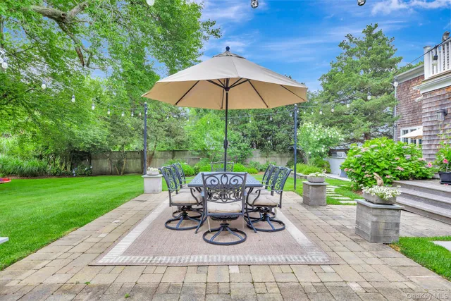 a view of a backyard with sitting area and furniture