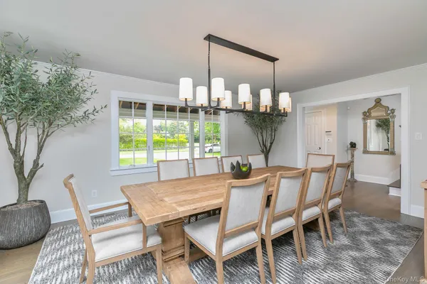 a dining room with furniture and window