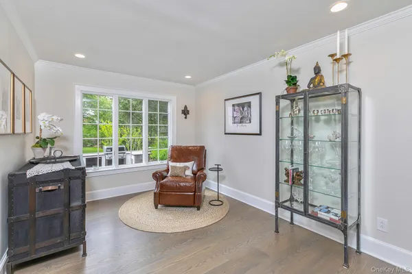 a living room with furniture and large windows