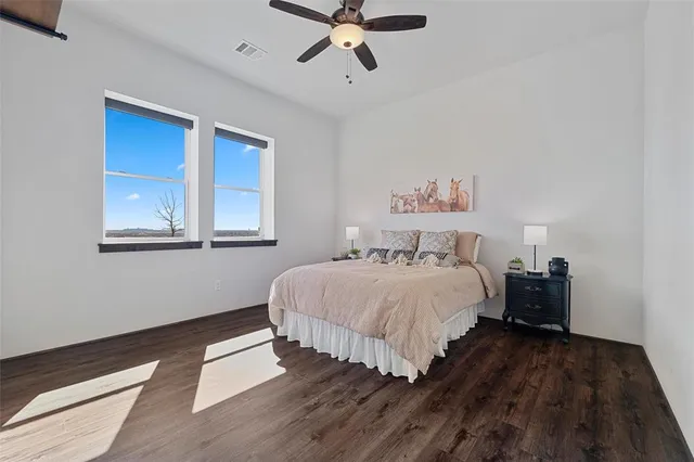 a bedroom with bed window and wall painting