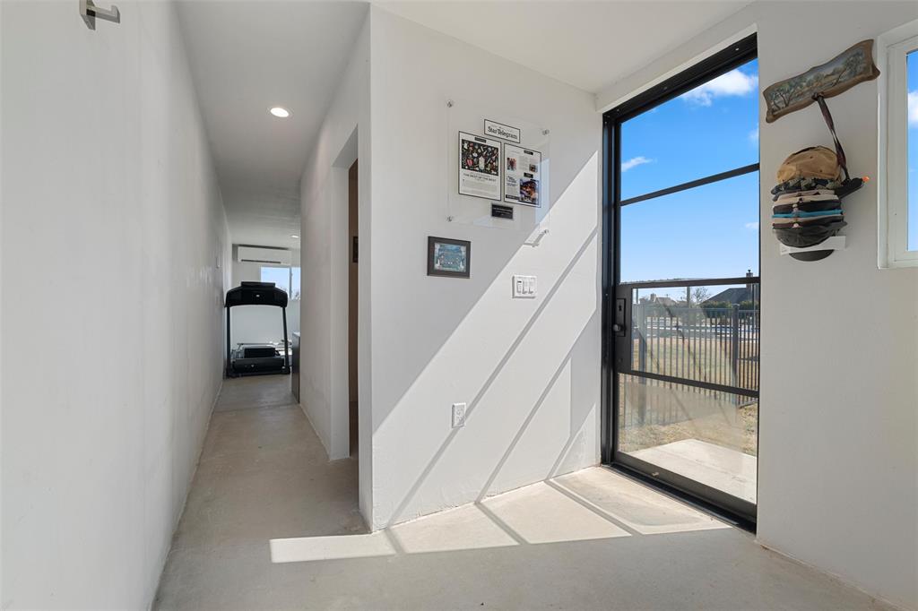 2219 Virginia Lane Haslet, TX 76052 - Photo 36 of 39 Hallway to half bath and bonus area in garage.