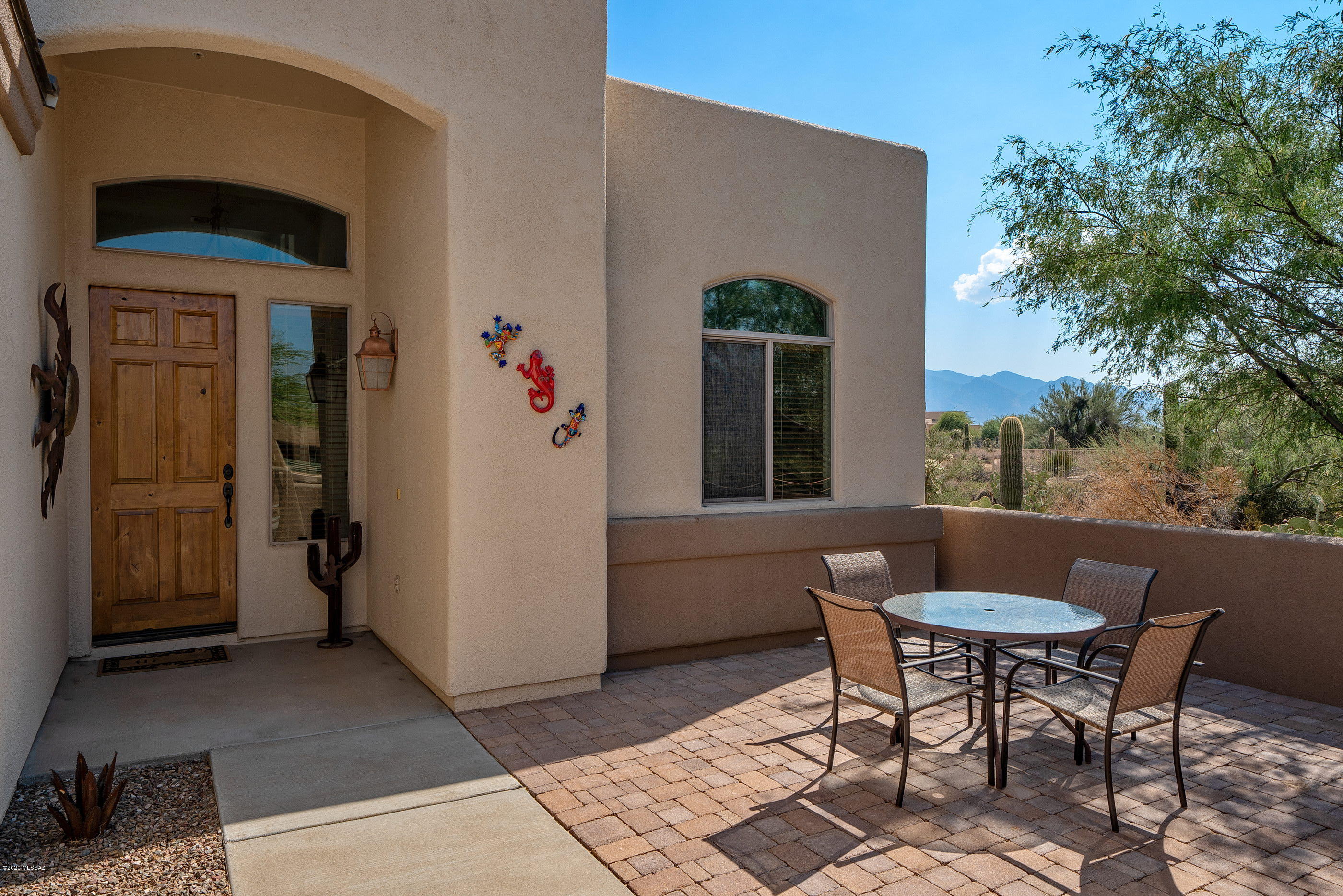 4440 West Crystal Ranch Place Marana, AZ 85658 - Photo 2 of 28 a backyard of a house with table and chairs