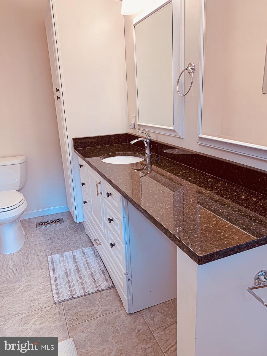 3301 Garrison Farms Road Pikesville, MD 21208 - Photo 16 of 41 Sleek bathroom with modern finishes.