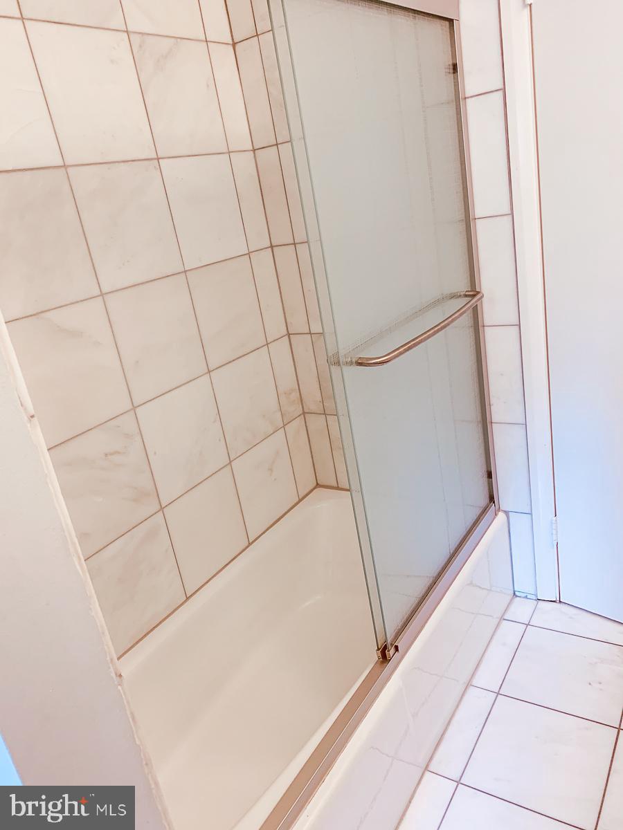 3301 Garrison Farms Road Pikesville, MD 21208 - Photo 25 of 41 Sleek shower space with modern design.