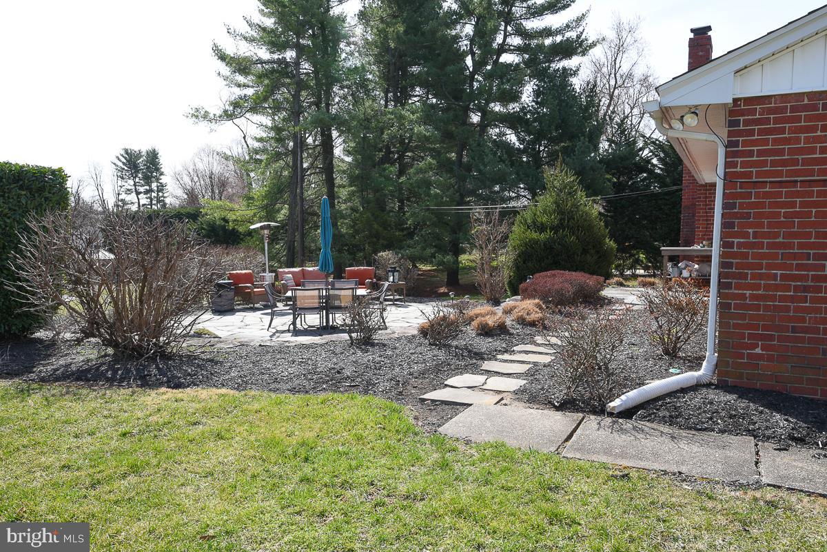 3301 Garrison Farms Road Pikesville, MD 21208 - Photo 36 of 41 Serene backyard oasis with stone pathway.
