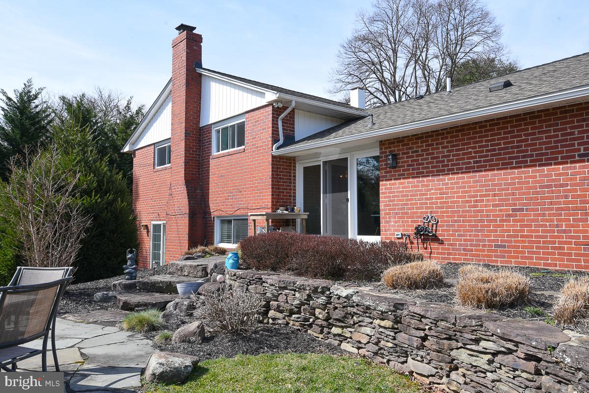 3301 Garrison Farms Road Pikesville, MD 21208 - Photo 38 of 41 Charming brick home with lush landscaping.