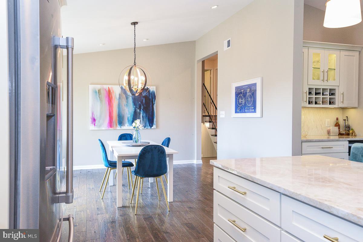 3301 Garrison Farms Road Pikesville, MD 21208 - Photo 4 of 41 Modern kitchen with vibrant dining area.