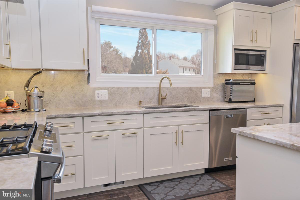 3301 Garrison Farms Road Pikesville, MD 21208 - Photo 10 of 41 Modern kitchen with sleek finishes and light.