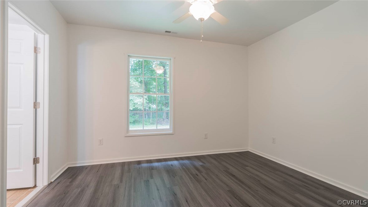 3616 Courthouse Road Hopewell, VA 23860 - Photo 25 of 40 an empty room with wooden floor and windows