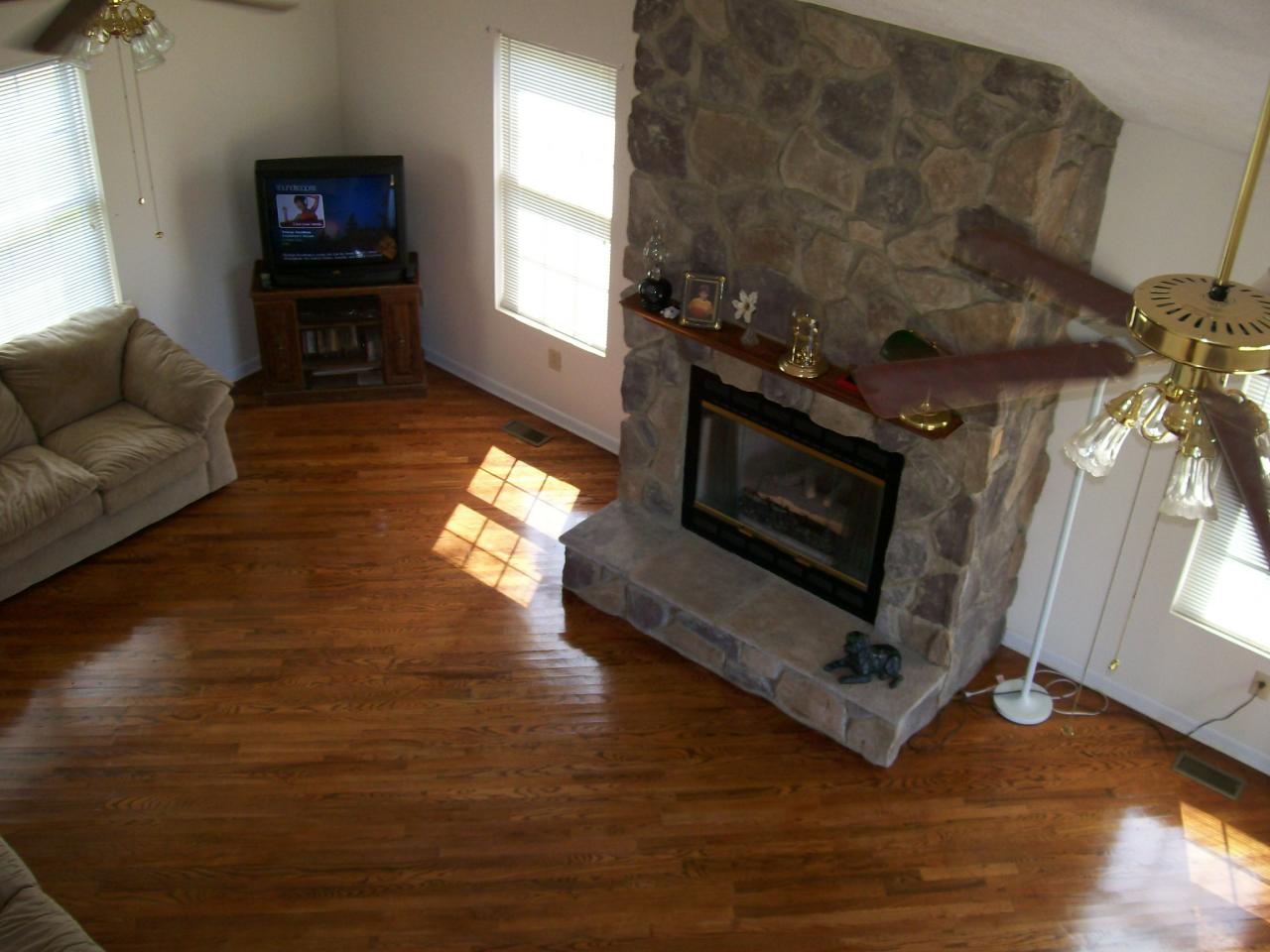 207 Farmington Road Hardy, VA 24101 - Photo 4 of 18 a living room with furniture wooden floor and a fireplace