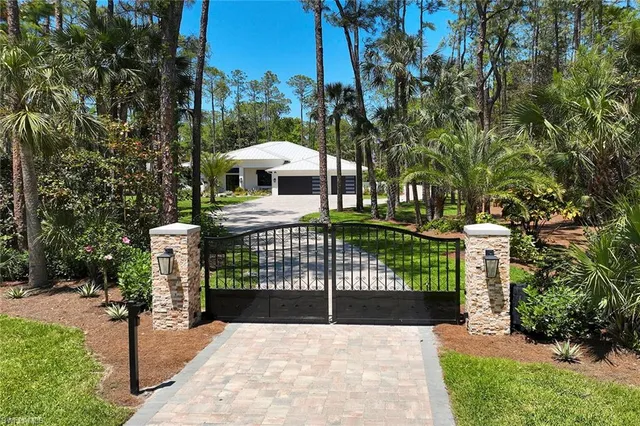 a view of a wrought iron fences in front of house