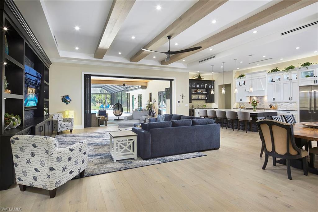 5301 Tamarind Ridge Drive Naples, FL 34119 - Photo 11 of 50 a living room with furniture and a large window