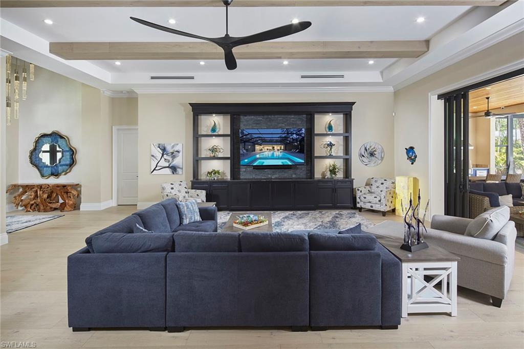 5301 Tamarind Ridge Drive Naples, FL 34119 - Photo 14 of 50 a living room with furniture and a window