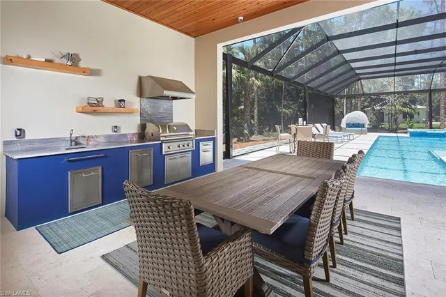 a dining room with a wooden table and chairs