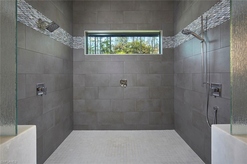 5301 Tamarind Ridge Drive Naples, FL 34119 - Photo 27 of 50 a bathroom with a shower