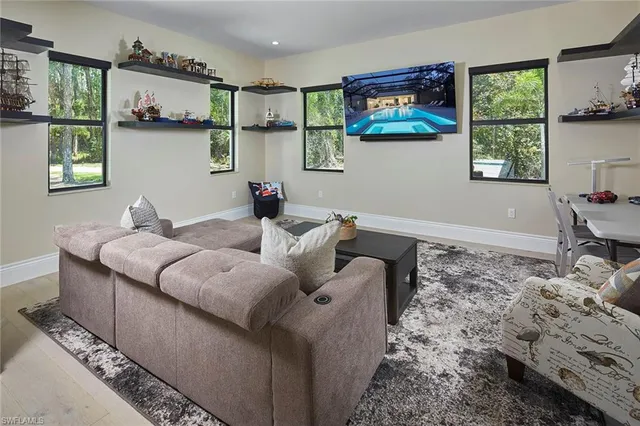 a living room with furniture and window