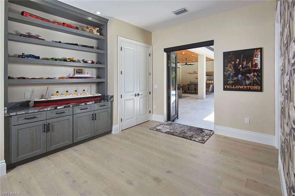 5301 Tamarind Ridge Drive Naples, FL 34119 - Photo 32 of 50 a room with storage and utility