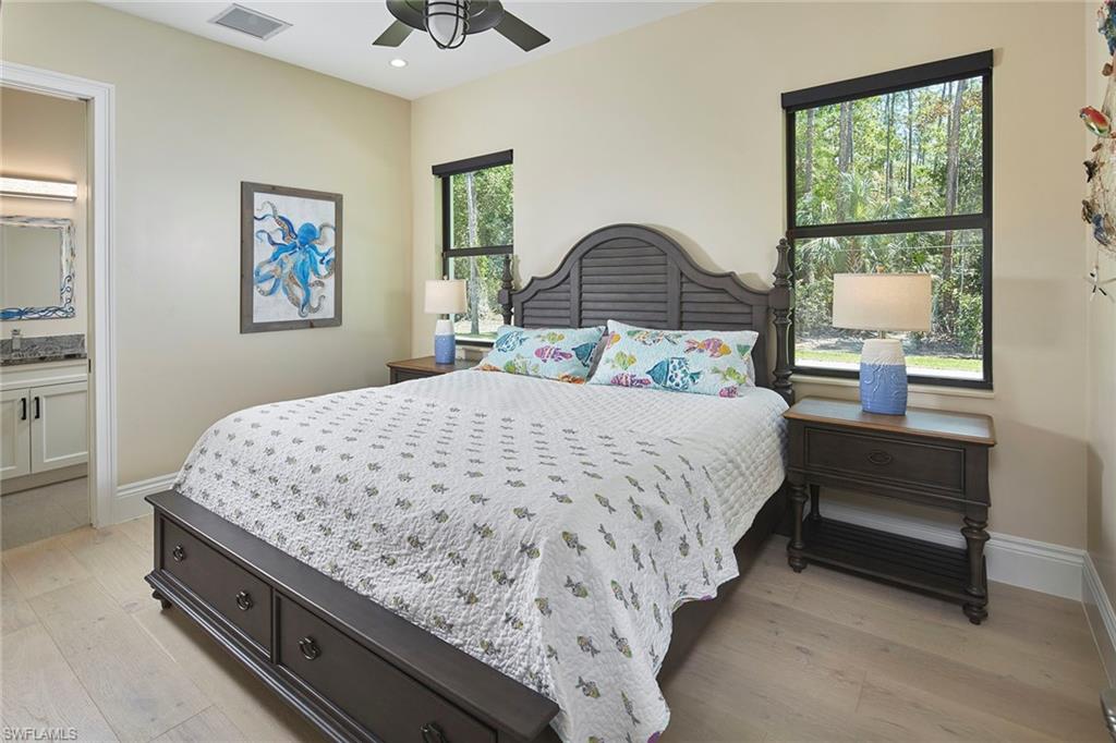 5301 Tamarind Ridge Drive Naples, FL 34119 - Photo 39 of 50 a bedroom with bed and window