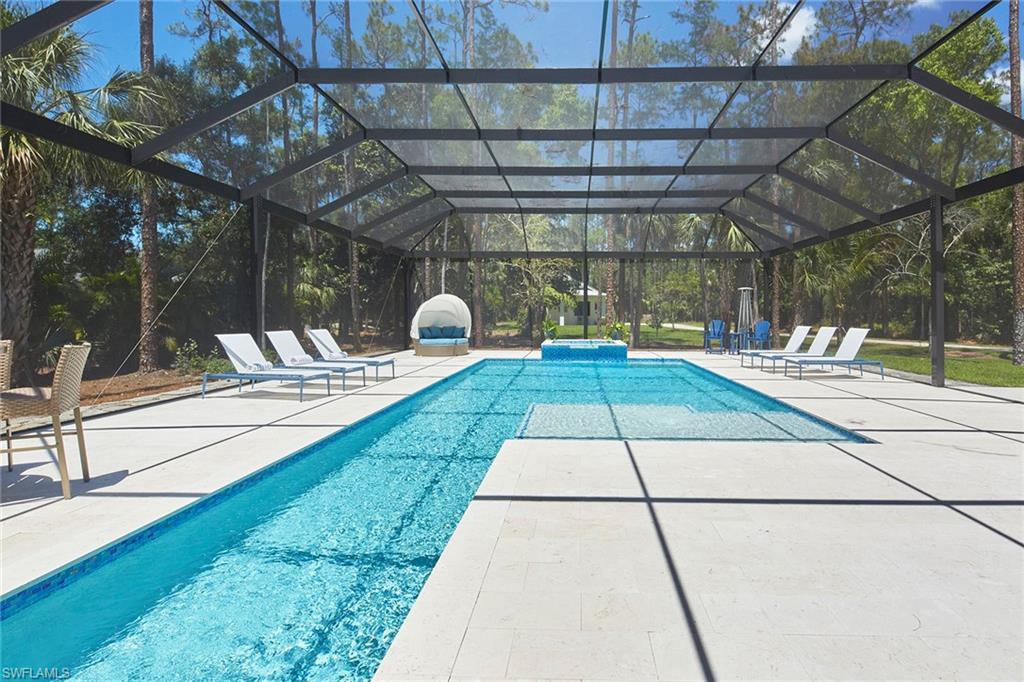 5301 Tamarind Ridge Drive Naples, FL 34119 - Photo 42 of 50 a view of a backyard with sitting area