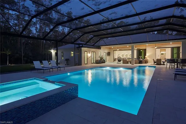 a view of a swimming pool with a patio