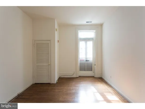 a view of an empty room and window