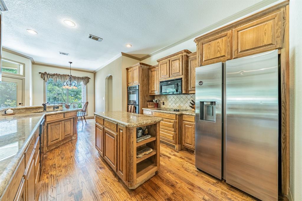 109 Overton Ridge Circle Weatherford, TX 76088 - Photo 7 of 27 Kitchen open to both dining areas.