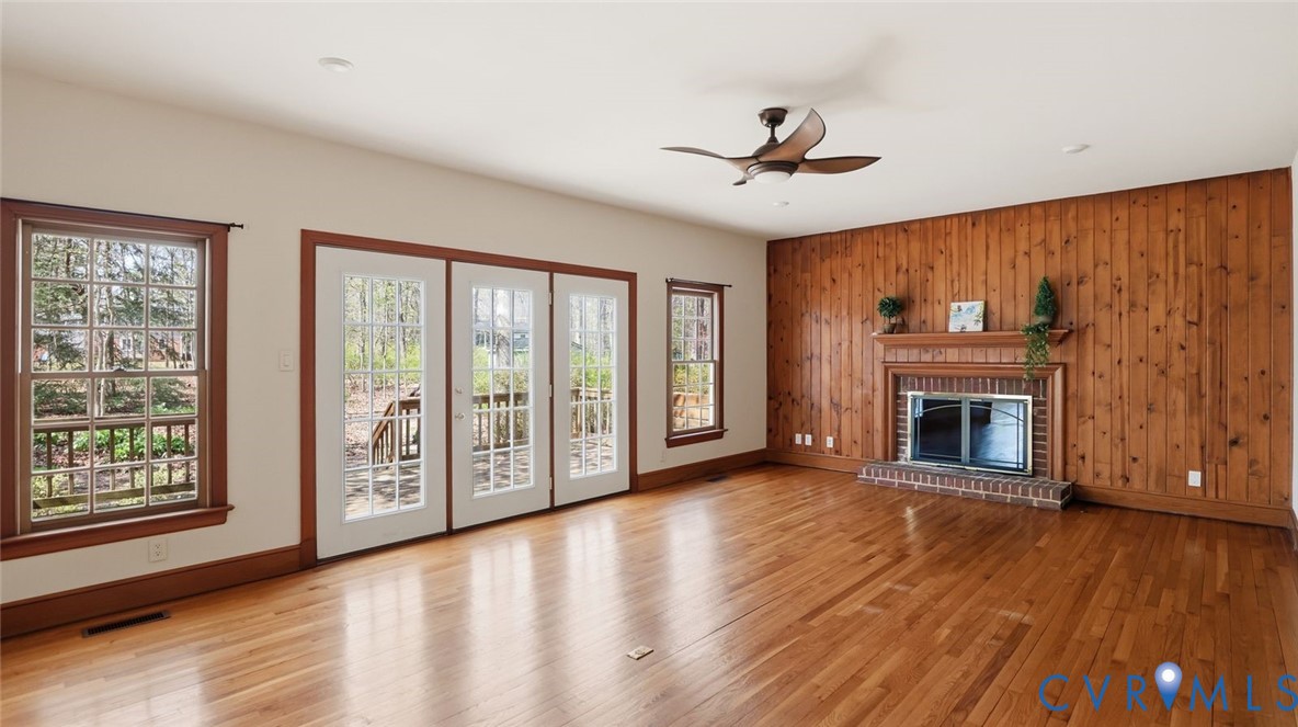 2560 Chartstone Drive Midlothian, VA 23113 - Photo 15 of 44 a view of an empty room with wooden floor fireplace and a window