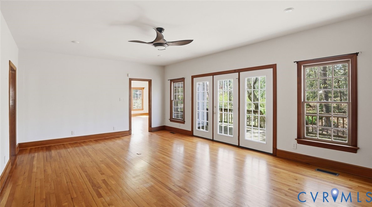 2560 Chartstone Drive Midlothian, VA 23113 - Photo 16 of 44 a view of an empty room with wooden floor and a window