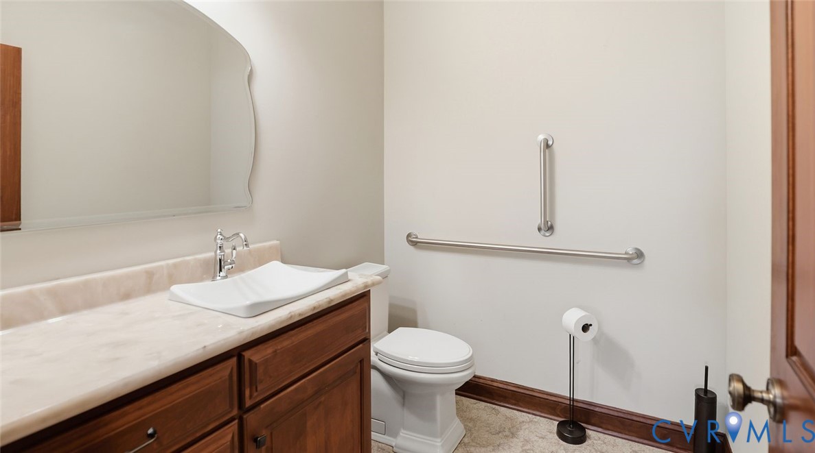 2560 Chartstone Drive Midlothian, VA 23113 - Photo 17 of 44 a bathroom with a sink a toilet and mirror