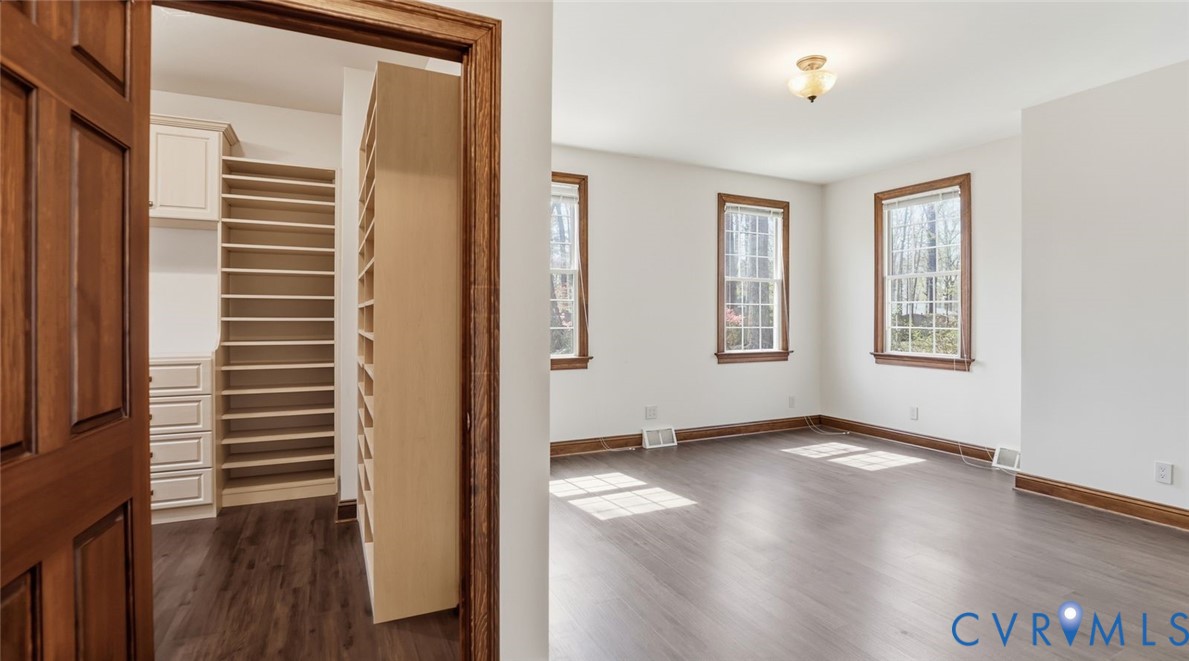 2560 Chartstone Drive Midlothian, VA 23113 - Photo 19 of 44 an empty room with wooden floor and windows