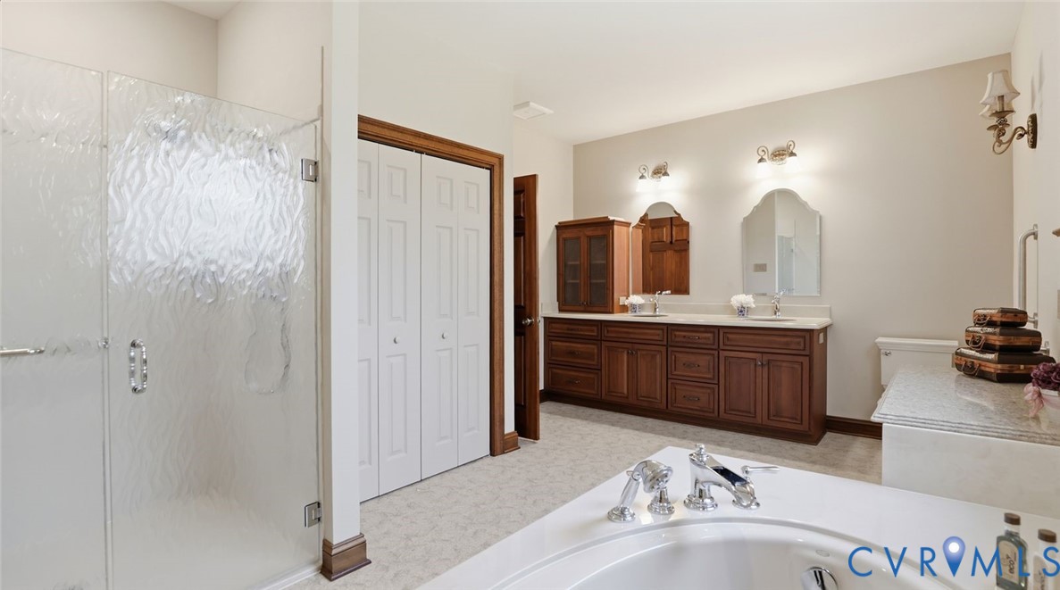 2560 Chartstone Drive Midlothian, VA 23113 - Photo 22 of 44 a bathroom with a double vanity sink mirror and shower