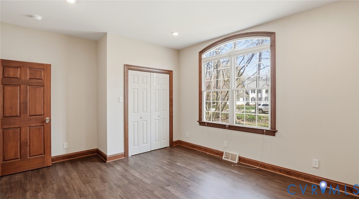 2560 Chartstone Drive Midlothian, VA 23113 - Photo 25 of 44 an empty room with wooden floor and windows