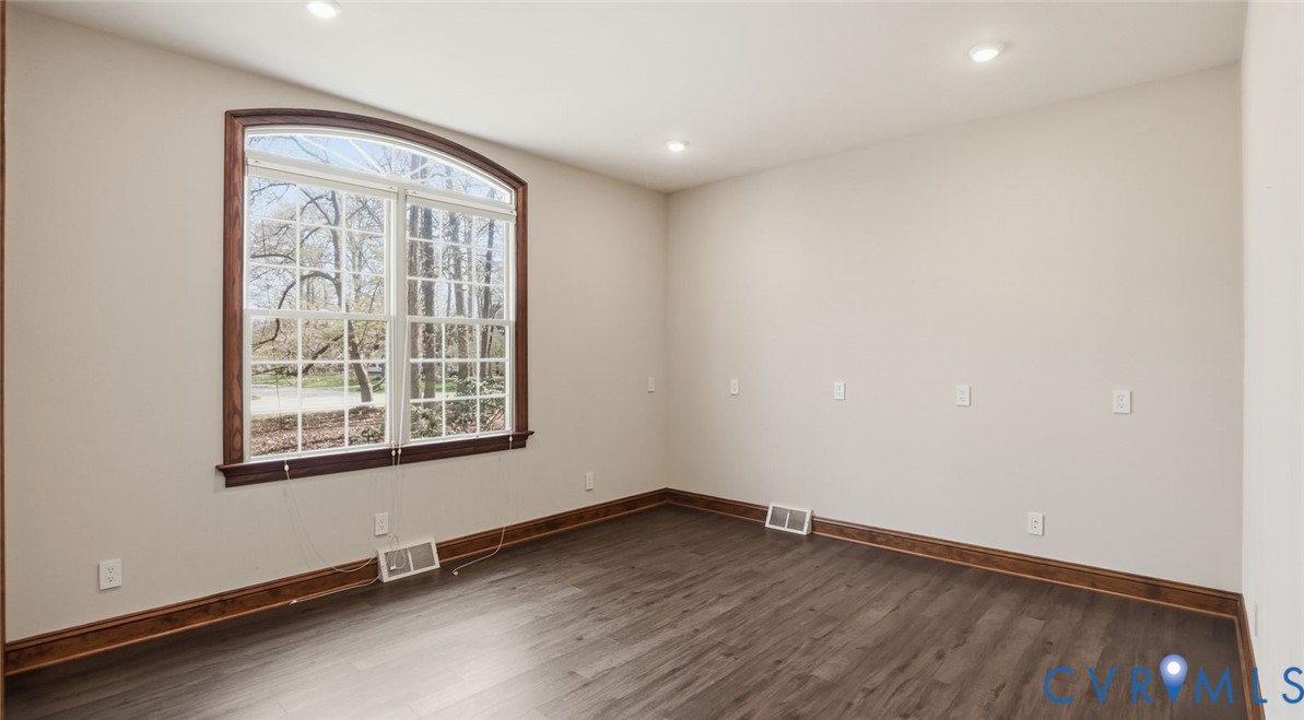2560 Chartstone Drive Midlothian, VA 23113 - Photo 26 of 44 an empty room with wooden floor and windows