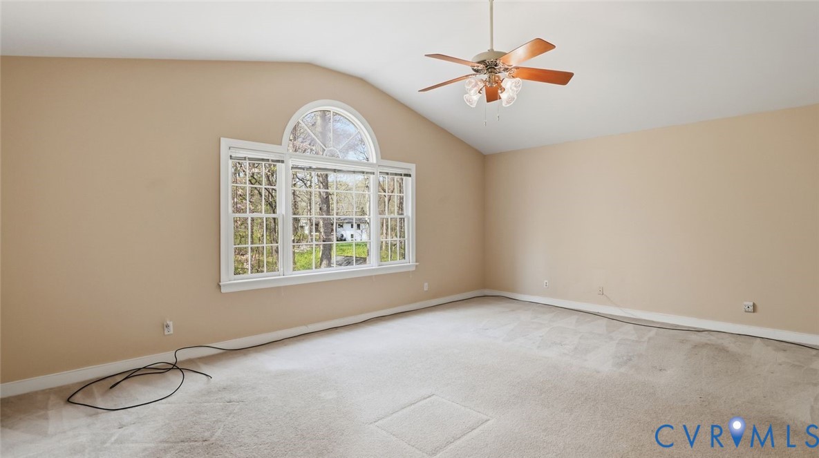 2560 Chartstone Drive Midlothian, VA 23113 - Photo 27 of 44 an empty room with a window and a chandelier fan
