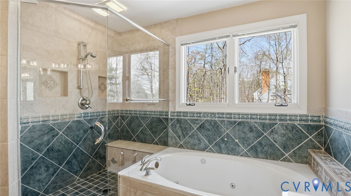 2560 Chartstone Drive Midlothian, VA 23113 - Photo 28 of 44 a bathroom with a bathtub a window and a shower