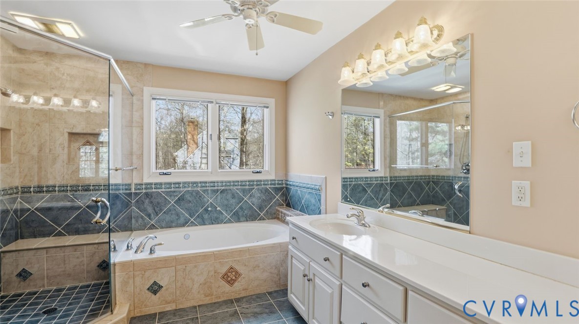 2560 Chartstone Drive Midlothian, VA 23113 - Photo 29 of 44 a bathroom with a tub a sink and large window