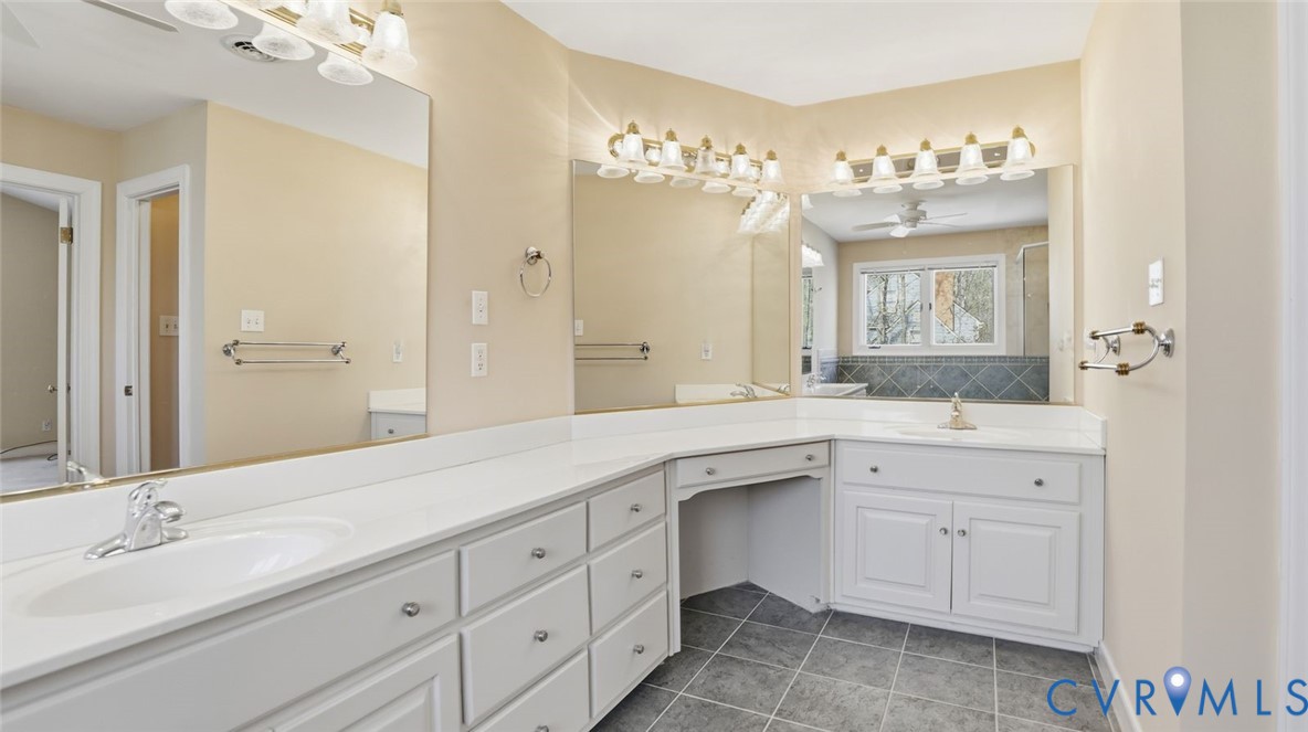 2560 Chartstone Drive Midlothian, VA 23113 - Photo 30 of 44 a spacious bathroom with a granite countertop sink mirror and a