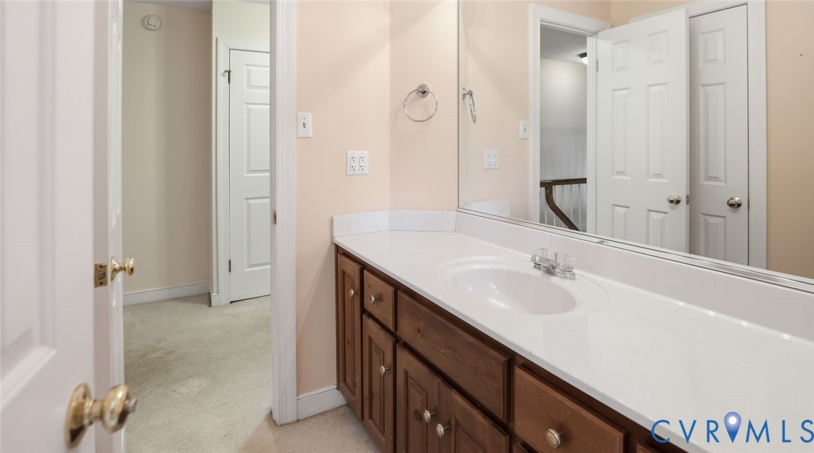 2560 Chartstone Drive Midlothian, VA 23113 - Photo 36 of 44 a bathroom with a granite countertop sink and a mirror