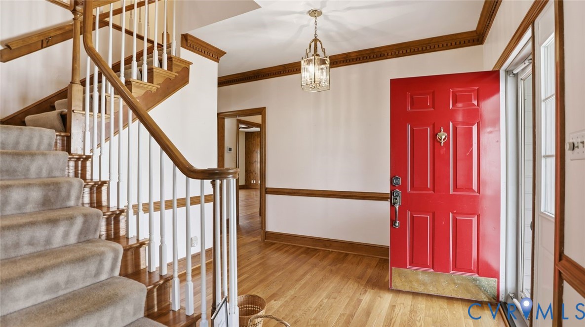 2560 Chartstone Drive Midlothian, VA 23113 - Photo 5 of 44 a view of a staircase with wooden floor and door