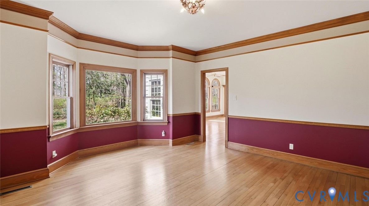 2560 Chartstone Drive Midlothian, VA 23113 - Photo 7 of 44 a view of an empty room with wooden floor and a window