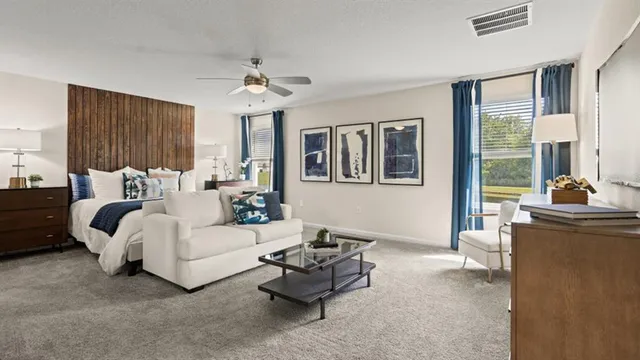 a living room with furniture and a large window