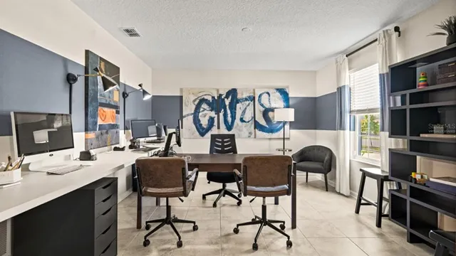 a view of a workspace with furniture