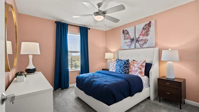 a bedroom with a large bed and a chandelier