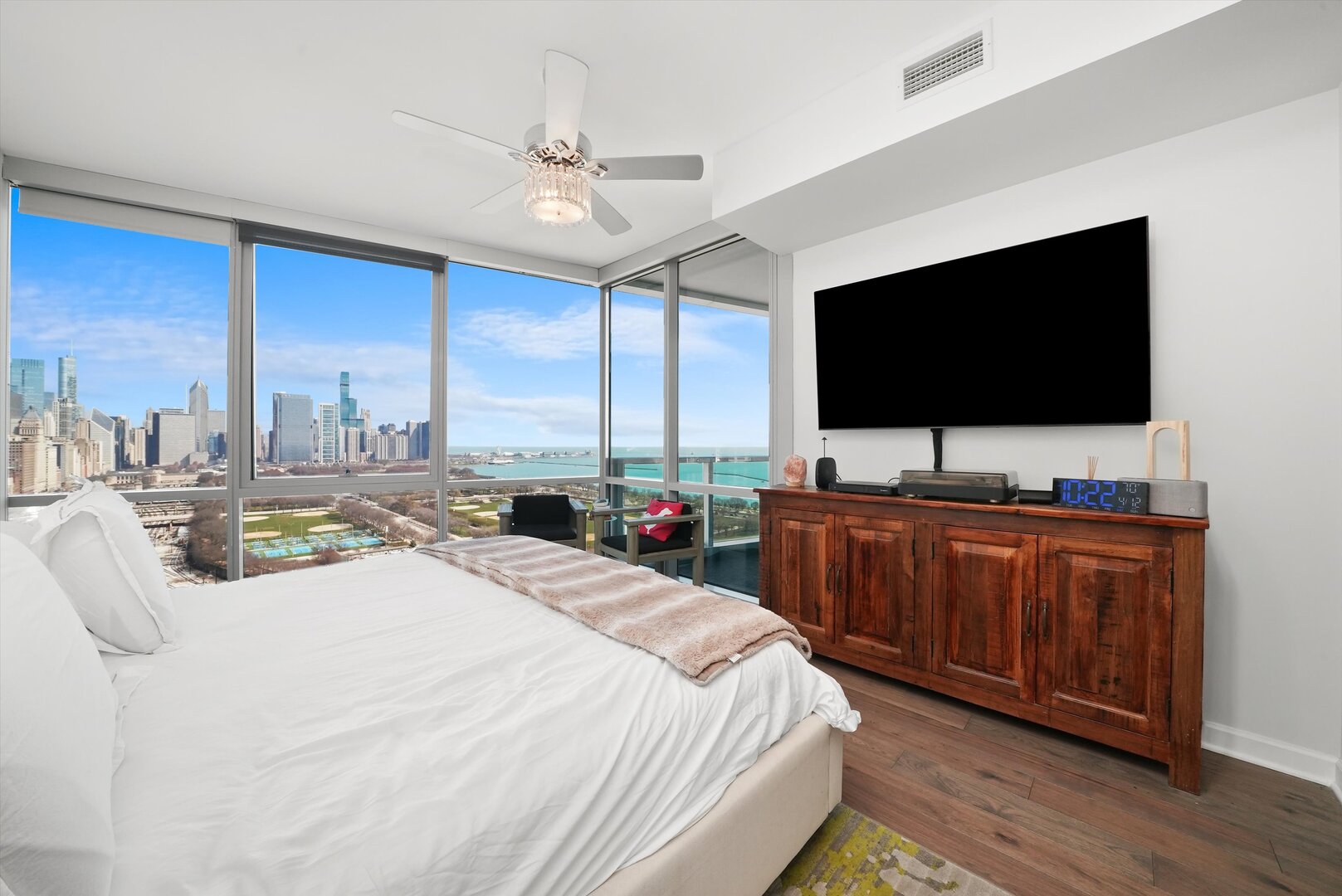 1201 South Prairie Avenue, Unit 2403 Chicago, IL 60605 - Photo 19 of 52 a bed room with a bed television and a large window