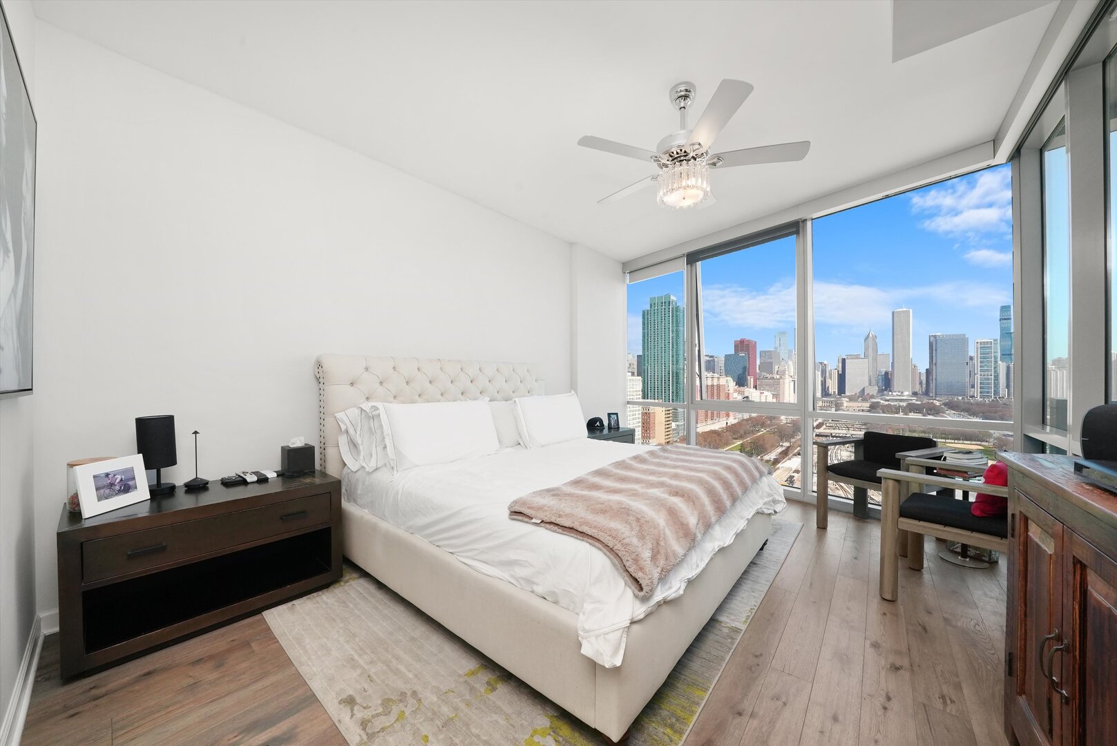 1201 South Prairie Avenue, Unit 2403 Chicago, IL 60605 - Photo 20 of 52 a bedroom with a bed and wooden floor