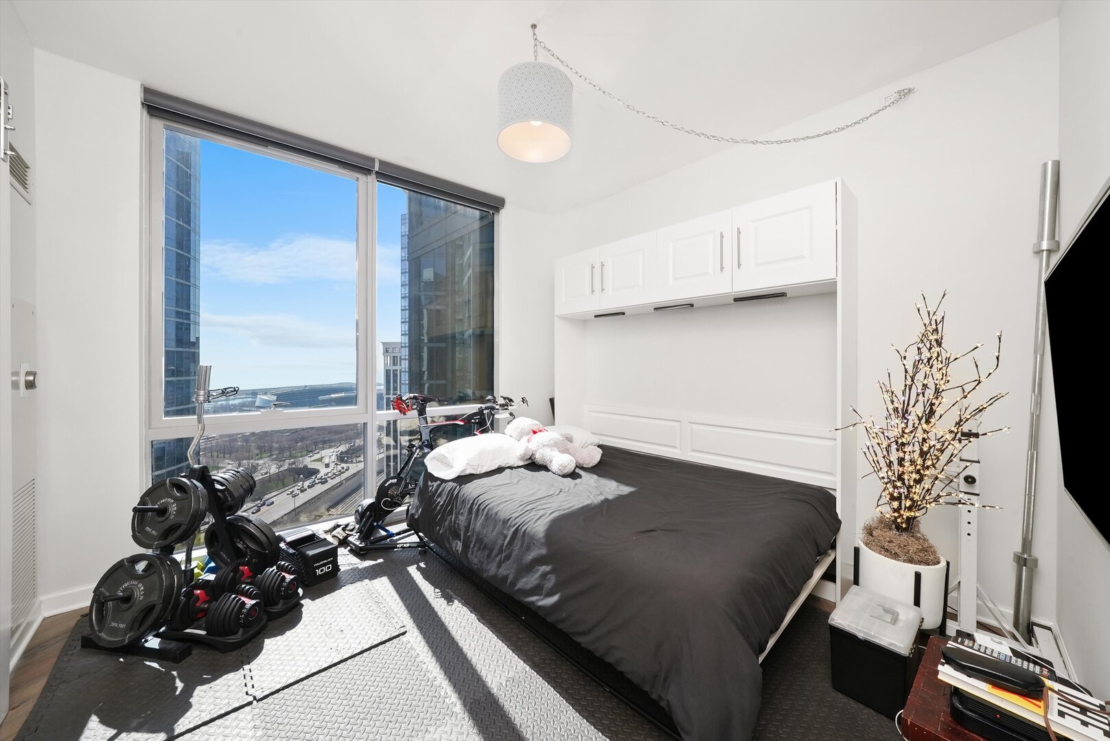 1201 South Prairie Avenue, Unit 2403 Chicago, IL 60605 - Photo 27 of 52 a bedroom with a bed and a large window