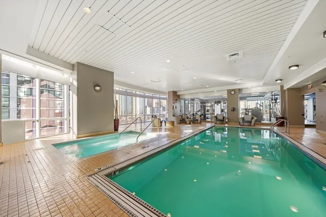 a living room with furniture a rug and a flat screen tv