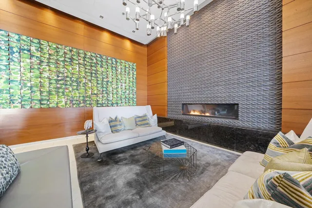 a view of a dining room with furniture wooden floor and chandelier