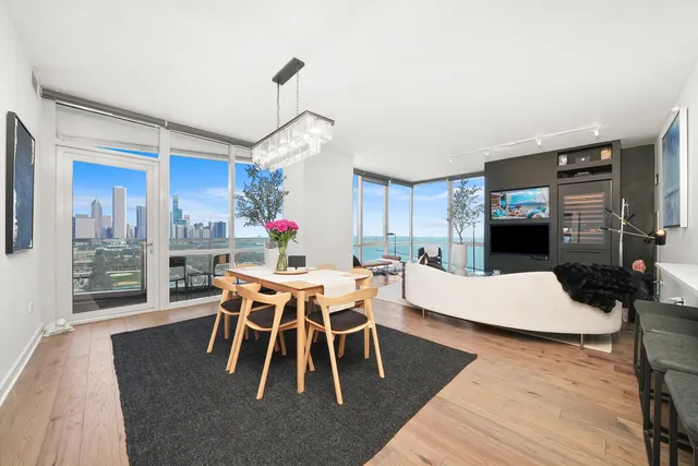 a living room with furniture and a view of kitchen
